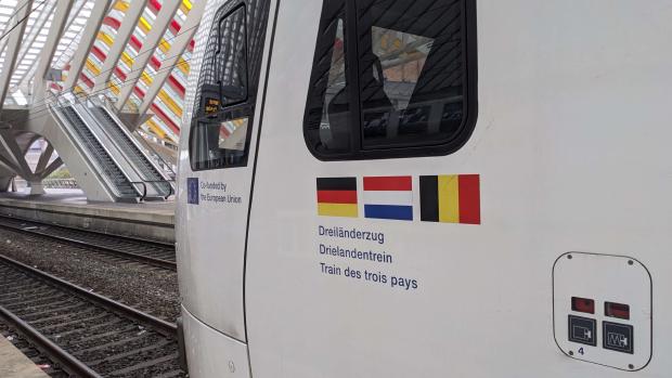 German, Dutch and Belgian flag on the Drielandentrein with the EU flag with text that says Co-funded by the European Union.