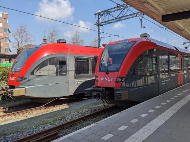 Two red Stadler GTW's at Dordrecht station.