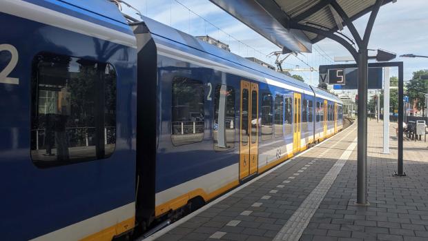 Train about to depart with a timer at the platform reading 5 seconds.