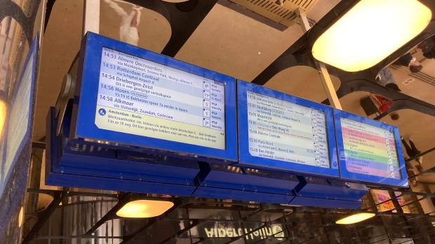 Departure screen showing many train routes, three of which using 'via' to highlight an upcoming station.